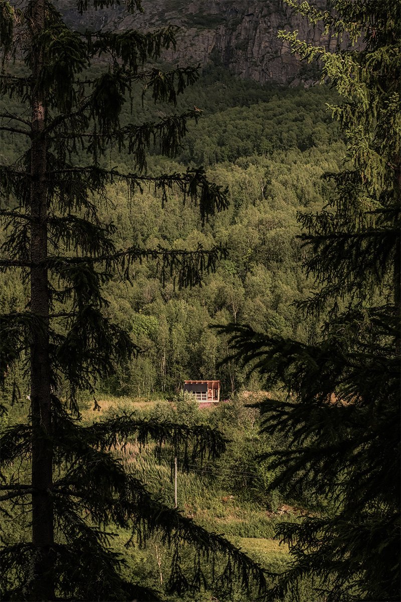 student collective builds fireplace shelter from reclaimed materials in northern norway