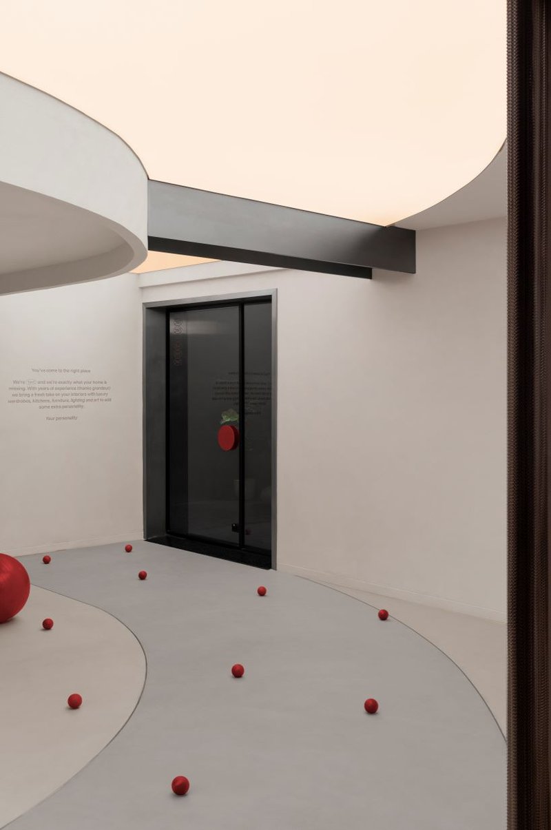 concrete and steel textures shape showroom in india organized as a continuous loop